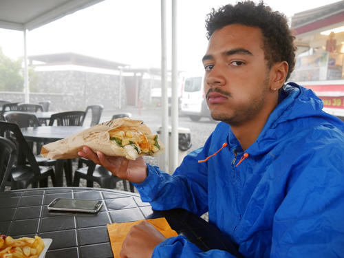 Cheap sandwiches with melted cheese and French fries can be found on every street corner in Saint-Denis.