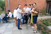 Summer school students and faculty of the Center for German Studies (ZDS) Peking enjoy the garden of the International House during a reception held for them.